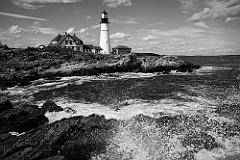 Waves Splatter at Portland Head Light At High Tide in Maine -BW